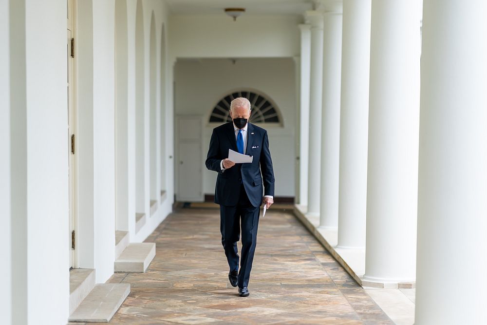 President Joe Biden walks to the Oval Office, Monday, February 14, 2022, after his trip to Camp David. (Official White House…