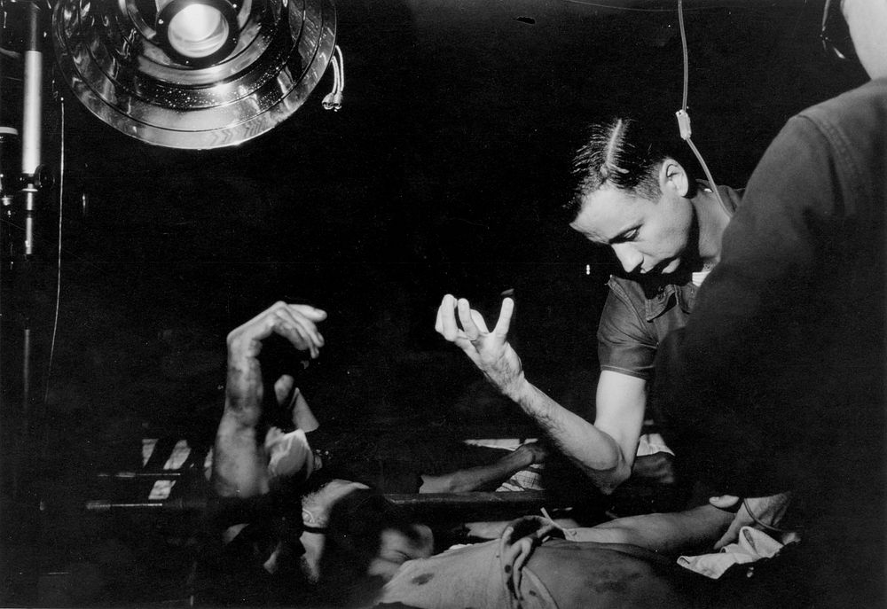 Navy Doctor Paul Comer of Mesa, Arizona examines a South Vietnamese Army casualty in the Field Hospital at Phu Bai, South…