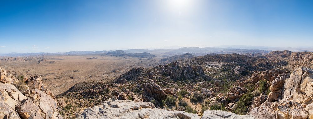 Queen Valley to Queen MountainA panorama depicting Queen Valley (on the left)—home to Joshua trees and Park Boulevard—and a…
