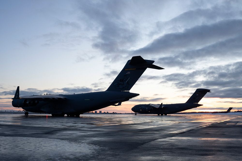 Air Force special warfare Airmen gear up for airborne operations at JBERAlaska Air National Guard C-17 Globemaster IIIs…