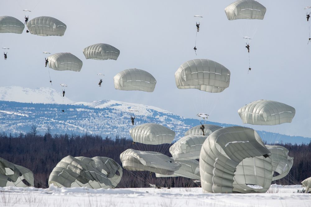 Air Force and Army conduct airborne operations at JBERArmy paratroopers from the 4th Infantry Brigade Combat Team…