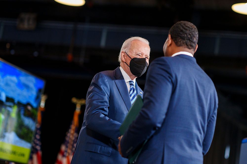 President Joe Biden greets EPA Administrator Michael Regan as he prepares to deliver remarks on Great Lakes restoration and…