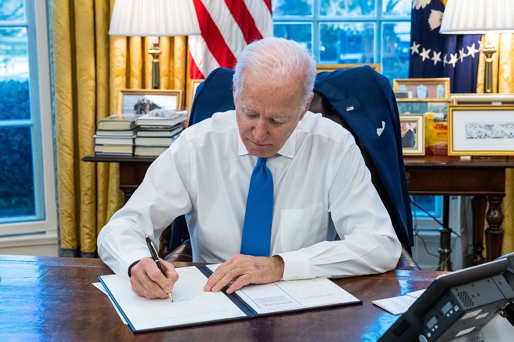 President Joe Biden signs an Executive Order on “Blocking Property of Certain Persons and Prohibiting Certain Transactions…