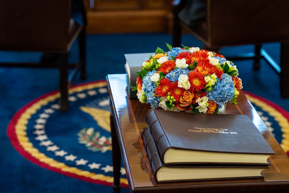 A floral arrangement sits on the coffee table in the Oval Office, Sunday, February 20, 2022. (Official White House Photo by…