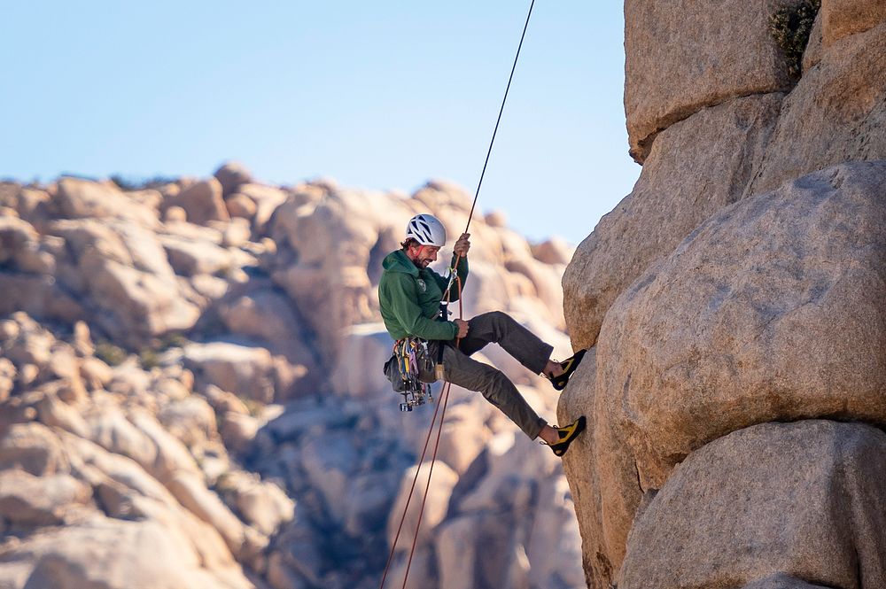 Climber steward rappelling in Hidden Valley Campground