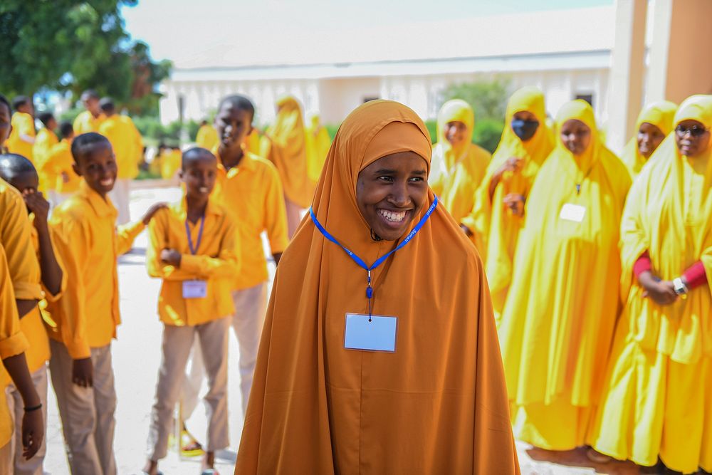 Fourteen-year-old Sabirin Ali Mohamud from Al-Muzamil Primary School in Mogadishu smiles outside a classroom after Primary…
