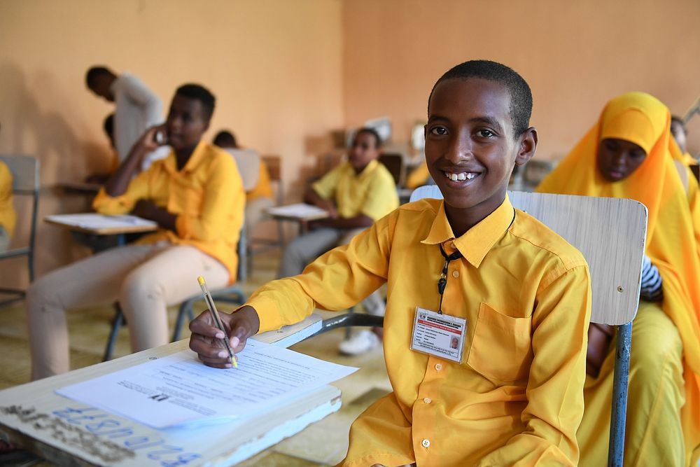 Class 8 boy student writes an English paper during the national Primary Education Certificate examinations in Mogadishu…