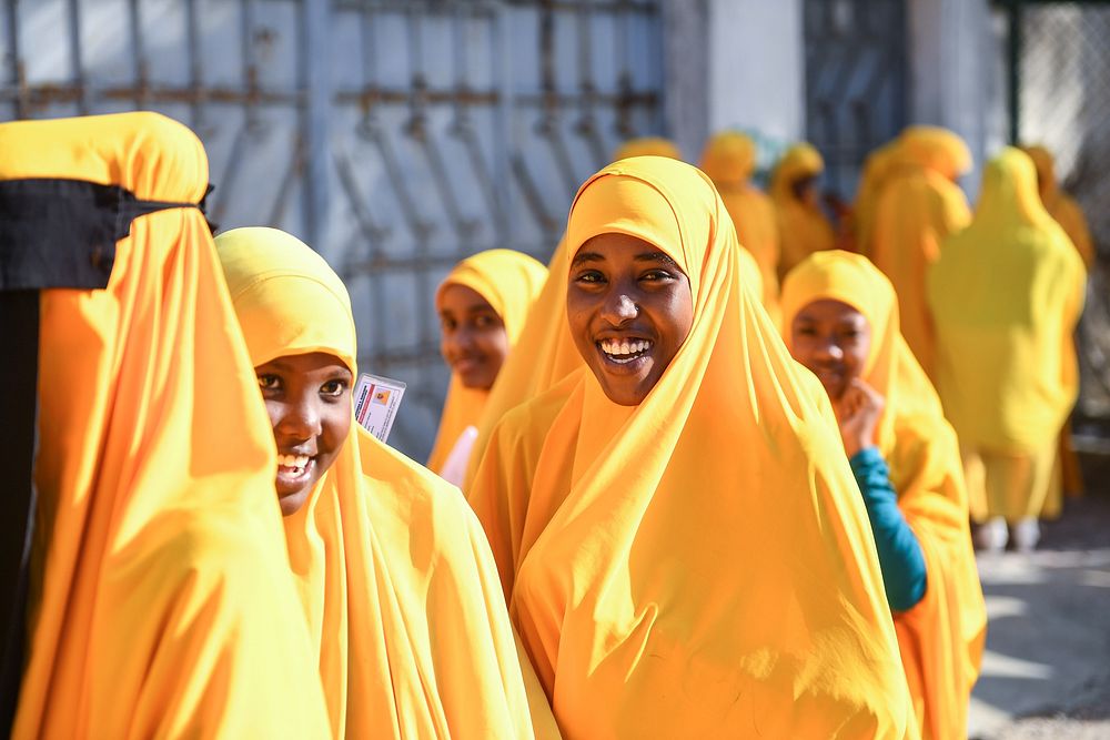 Female students stand outside an examination center after doing the national Primary Education Certificate examinations in…