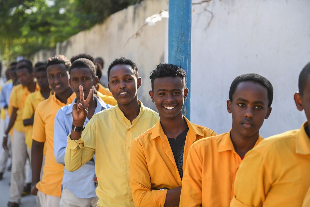 Class 8 students queueing to be frisked before going into an examination center in Mogadishu, Somalia, on 26 May, 2021.…