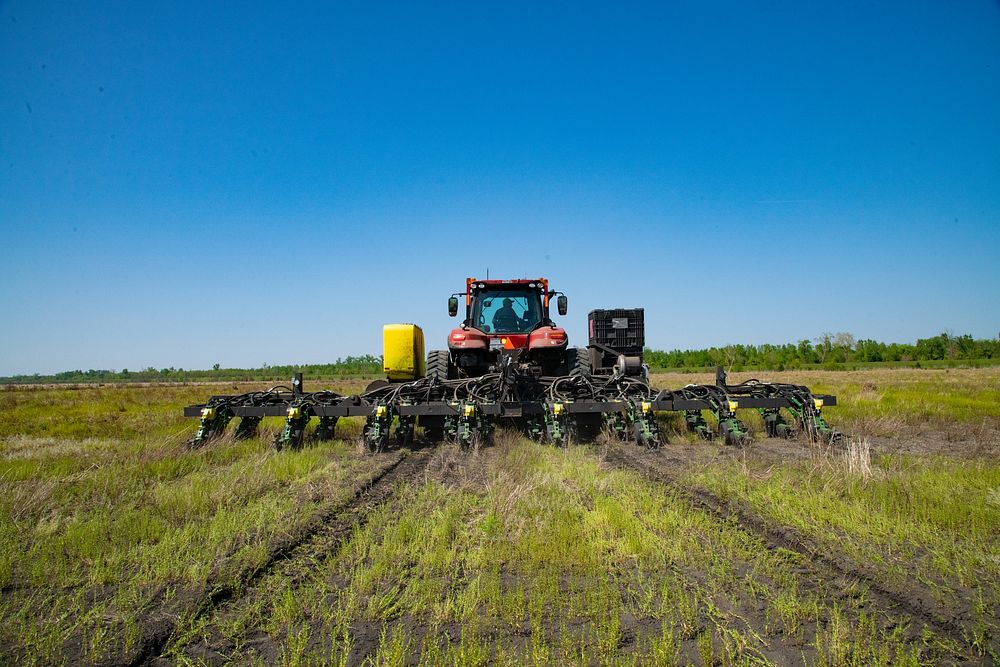 Tractor planting soybean seeds. Original public domain image from Flickr