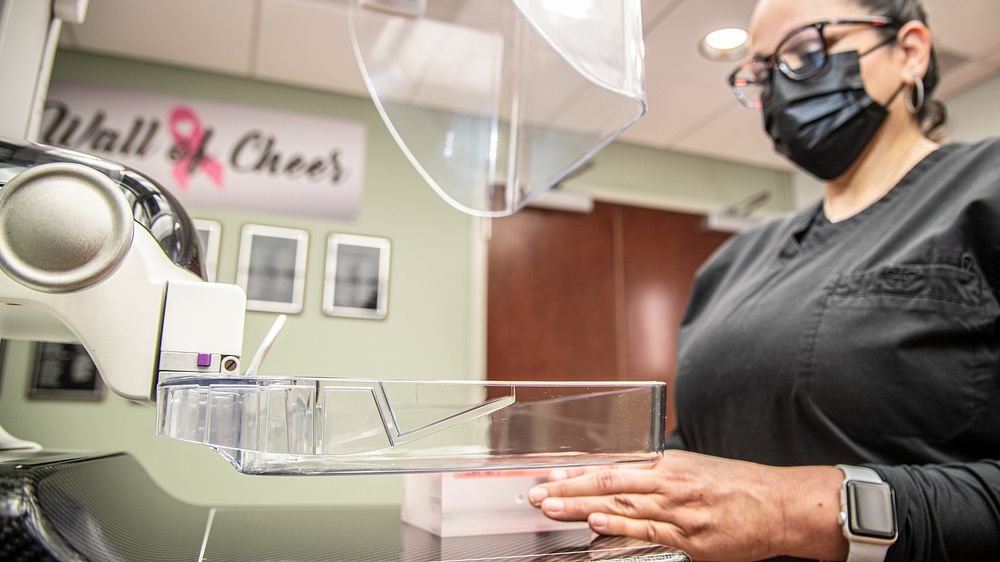 Radiology technician, Kristy Garcia uses a shadow test target to demonstrate how 3-dimensional (3D) mammography system…