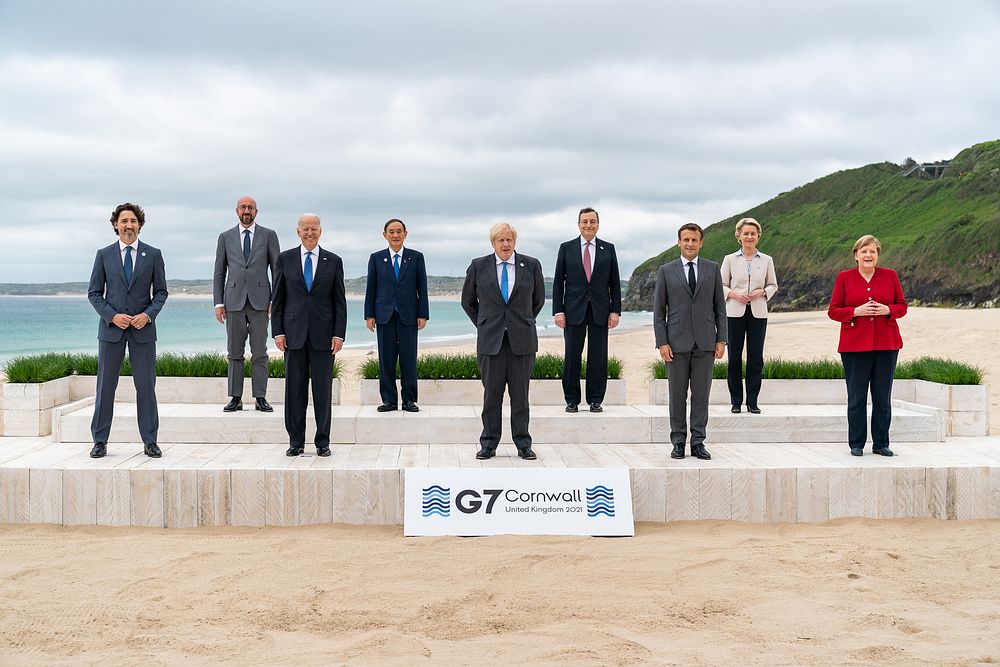 President Joe Biden takes a G7 leaders family photo at the Carbis Bay Hotel and Estate in St. Ives, Cornwall, England. June…