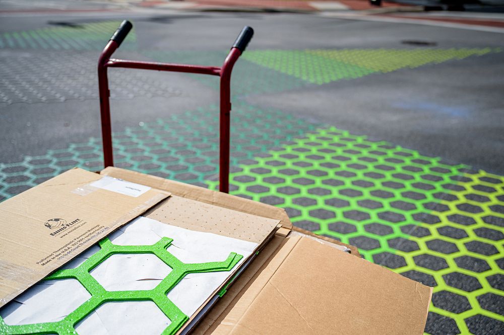 Intersection pavement artwork is installed at Reade Circle and Evans Street on Monday, June 28, 2021. Original public domain…