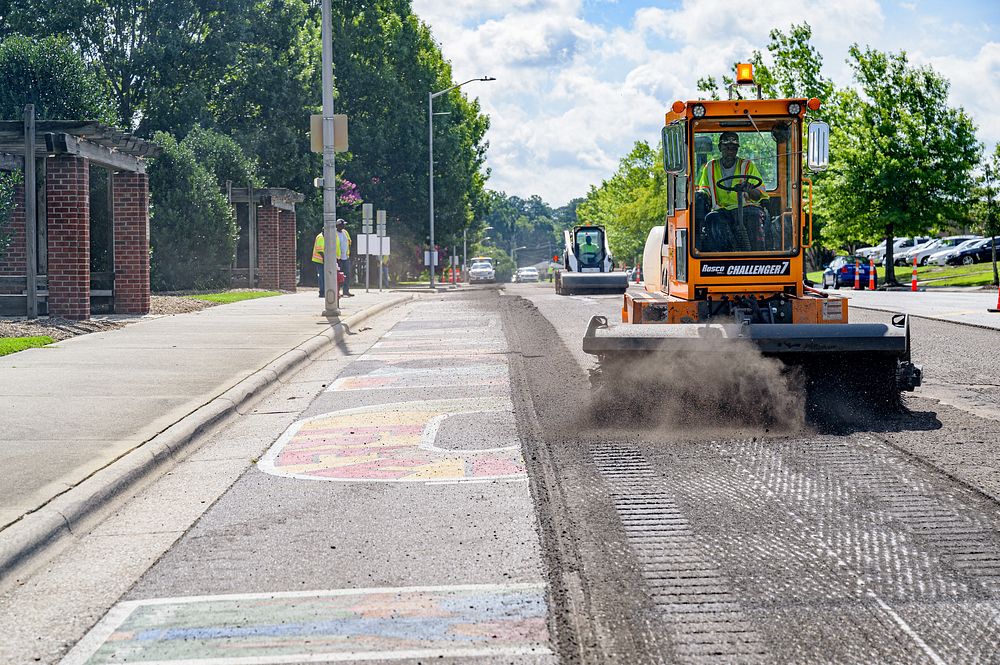 Crews begin removing asphalt along First Street at Town Common where the Unite Against Racism mural was located, between…