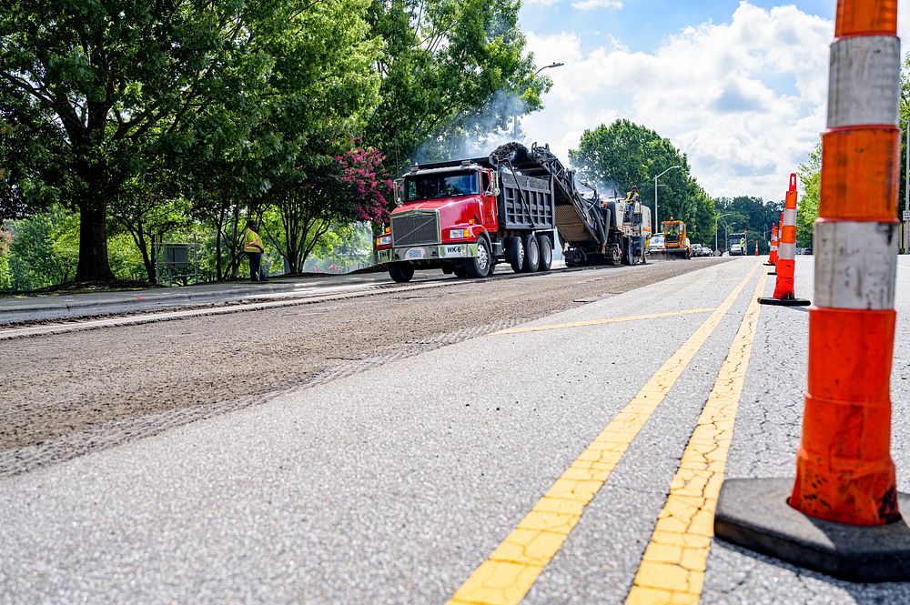 Crews begin removing asphalt along First Street at Town Common before repaving between Cotanche and Washington Streets, July…