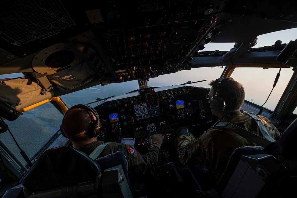 U.S. Air Force Capt. Brandon Johnson, left, and Lt. Col. Martin Ryan fly a KC-135R Stratotanker during a training mission at…