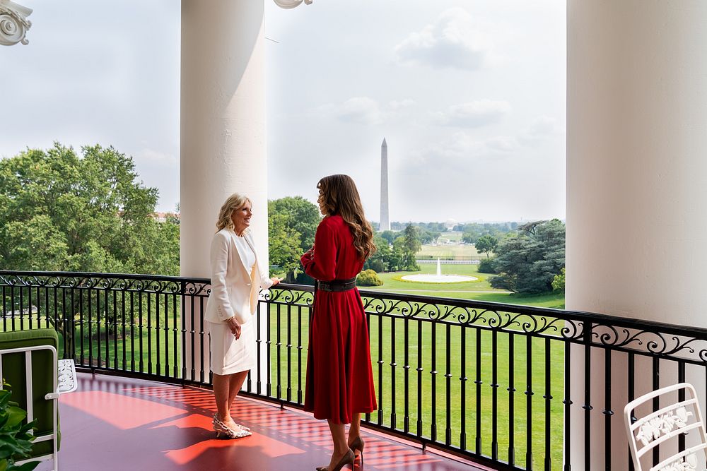 First Lady Jill Biden and Queen Rania of Jordan look out over the South Lawn of the White House and the Washington Monument…