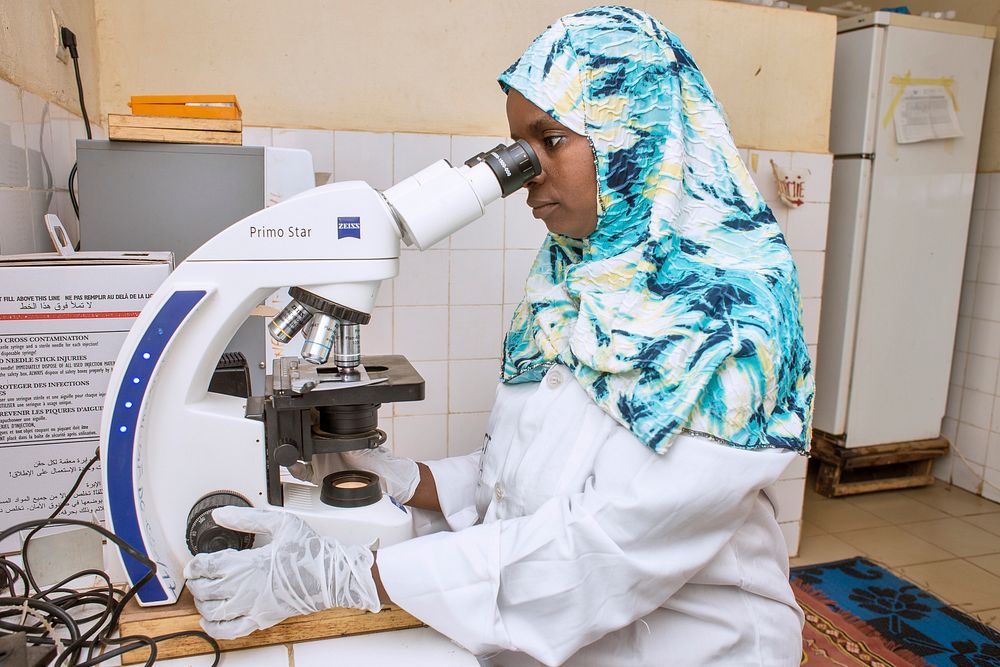 A microscopist in Niger conducts malaria microscopic examination.