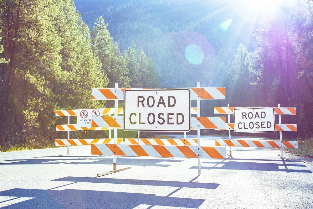 Road closed barricade sign.