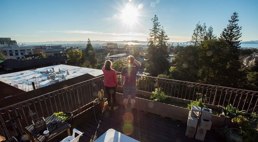 Couple on rooftop at cooperative housing facility.