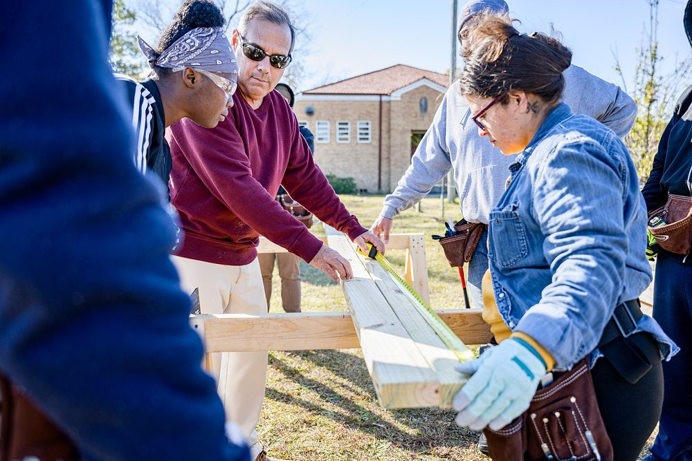 Students learn about subfloring and framing , Greenville, 2023. Original public domain image from Flickr