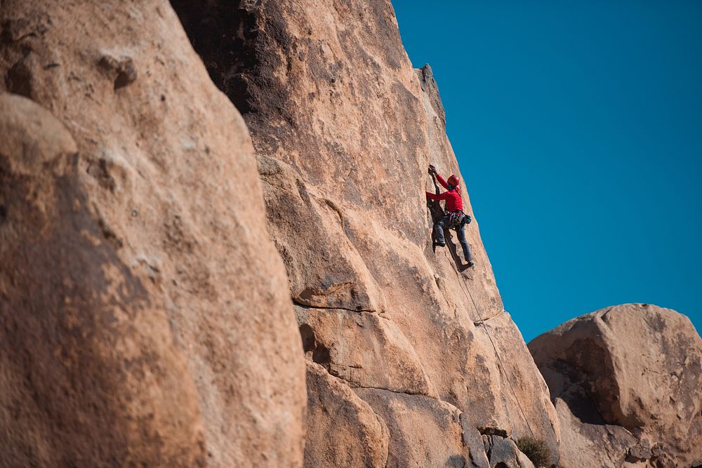 Climber ascends a rock face. 