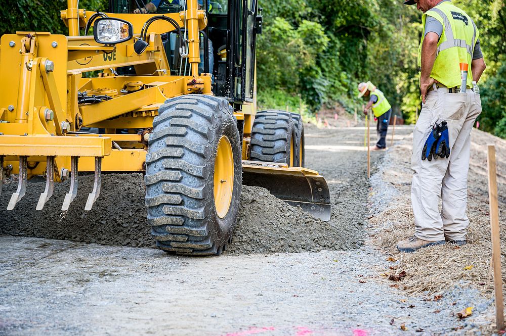 Construction on the greenway extension from Pitt Street to Memorial Drive nears completion as workers prepare for paving…