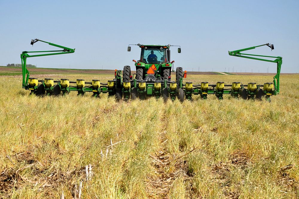 Using a no-till planter, north-central Iowa farmer, Tim Smith, plants soybeans into a terminated cereal rye cover crop.…