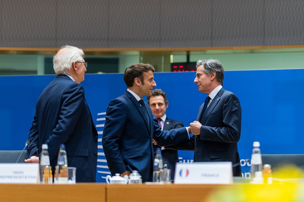 Secretary of State Antony Blinken talks with French President Emmanuel Macron at a European Council meeting Thursday, March…