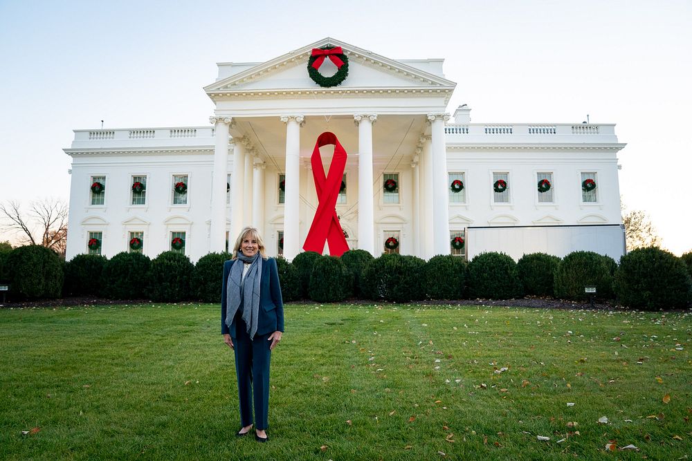 First Lady Jill Biden greets installers and views the World AIDS Day ribbon Tuesday, November 30, 2021, on the White House…