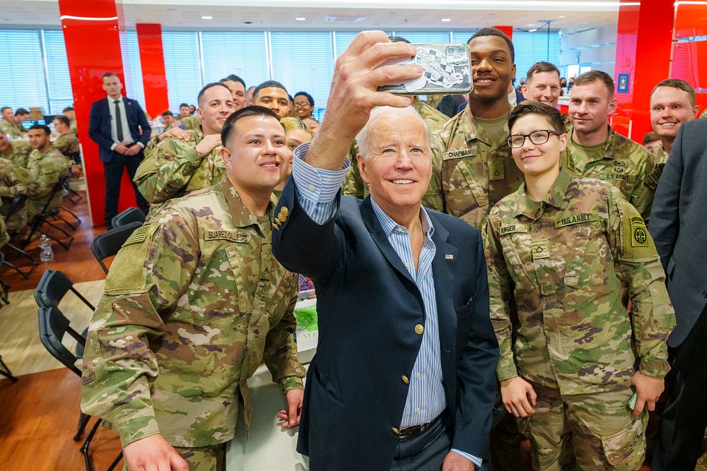 President Joe Biden greets service members of the 82nd Airborne division, Friday, March 25, 2022, at the dining facilities…
