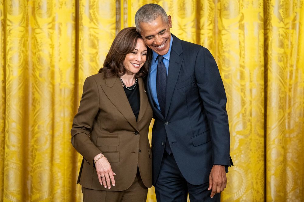 Former President Barack Obama hugs Vice President Kamala Harris during an Affordable Care Act event with President Joe…
