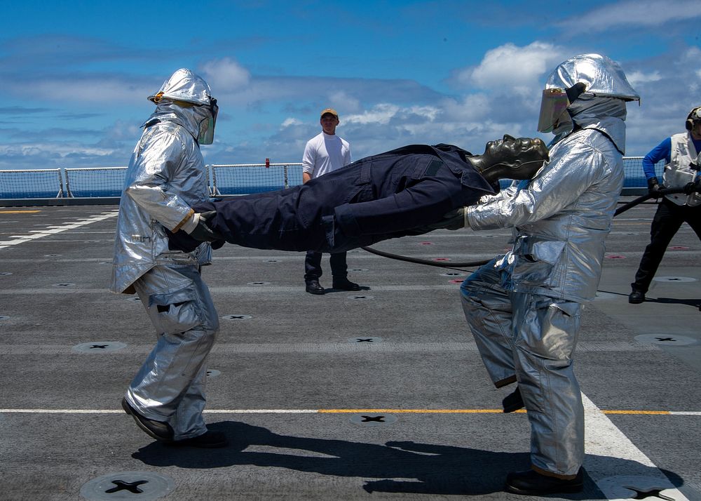 Mercy Conducts Flight Deck Fire Drill 220509-N-XB470-2012PACIFIC OCEAN (May 9, 2022) – U.S. Navy Sailors participate in a…