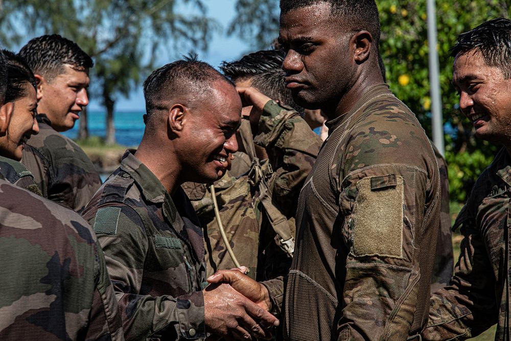 U.S. Army Hawaii Reserve soldiers from the 100th Battalion, 442nd Infantry Regiment, perform French combatives techniques on…