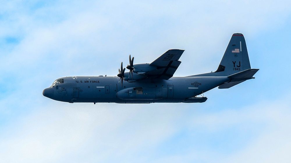 A U.S. Air Force C-130J Super Hercules assigned to the 36th Airlift Squadron flies after dropping a bundle over the south…