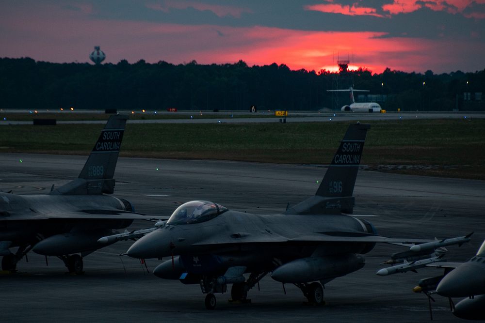 U.S. Air Force F-16 Fighting Falcon jets from the 169th Fighter Wing, South Carolina Air National Guard, are parked on the…