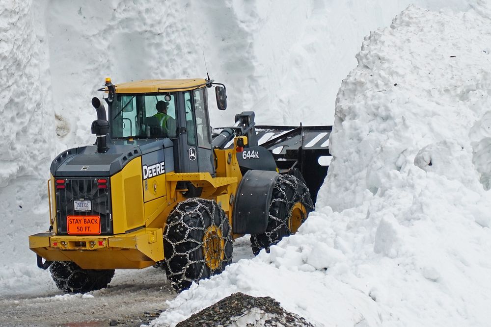 Snowplow WorkingGlacier National Park Road Crew plowing Triple Arches avalanche slide on June 6, 2022.