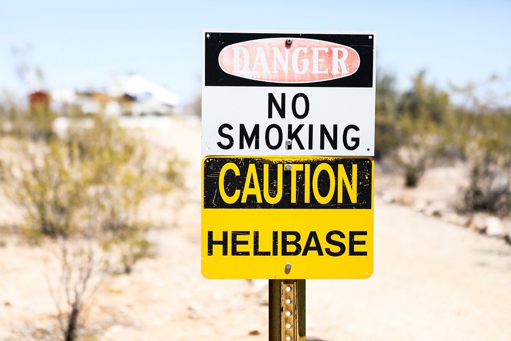 No smoking caution sign at helibase. Original public domain image from Flickr