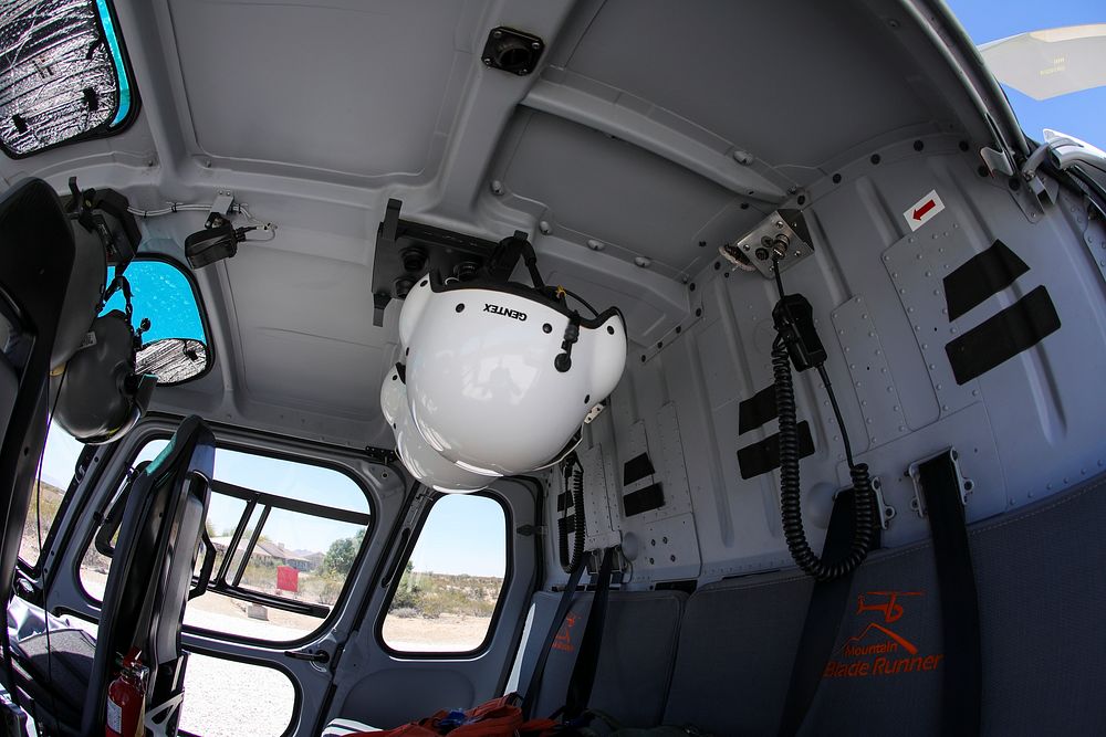 MAY 19: The cockpit of a helitack helicopterWICKENBURG, AZ - MAY 19: Helmets hang on the ceiling inside of a a helitack…