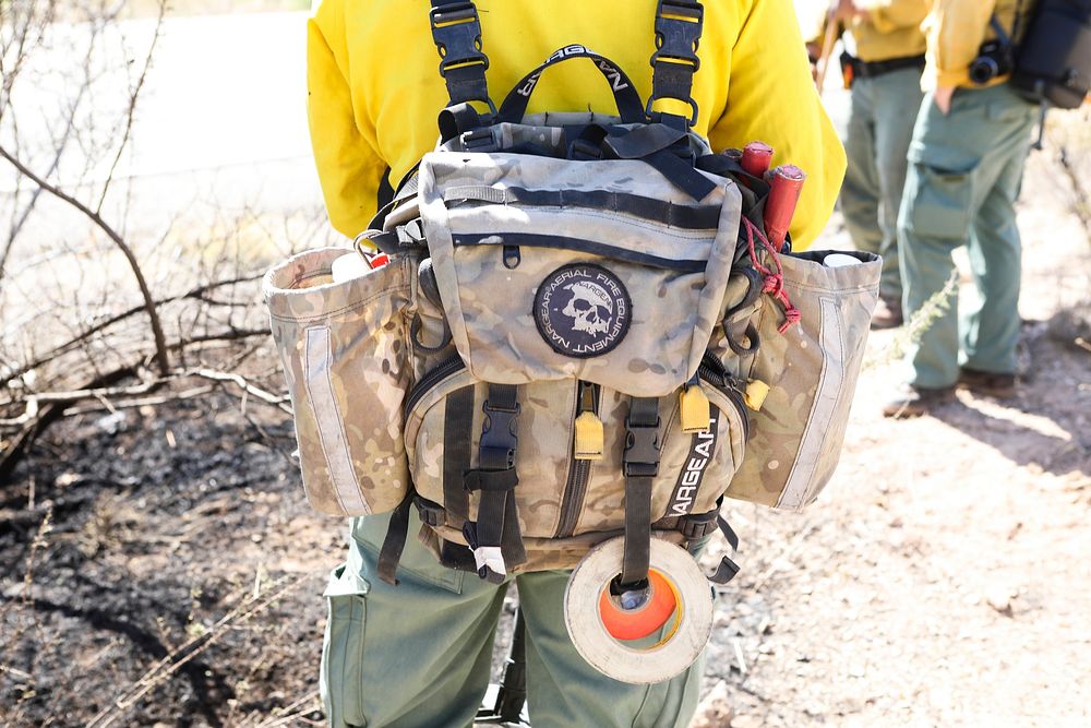 MAY 19: Mop up of brush fireWICKENBURG, AZ - MAY 19: Fire pack of a Phoenix District firefighter, called to mop up after a…