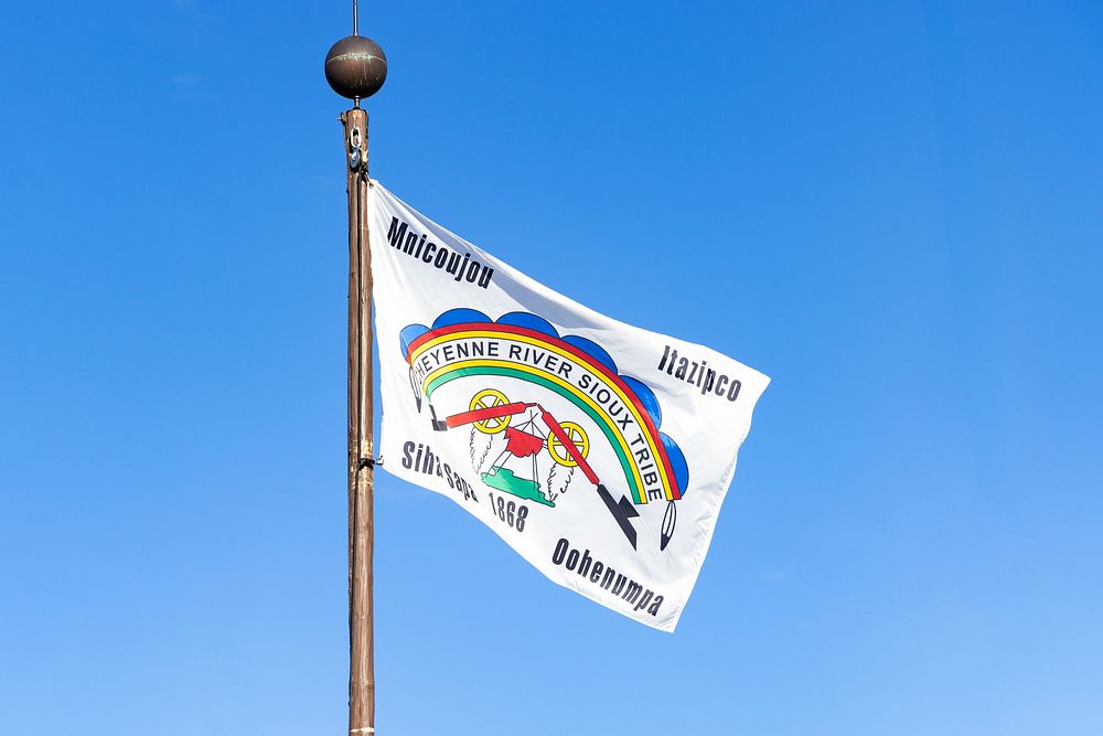 Cheyenne River Sioux Tribe flag over Old Faithful InnNPS / Jacob W. Frank