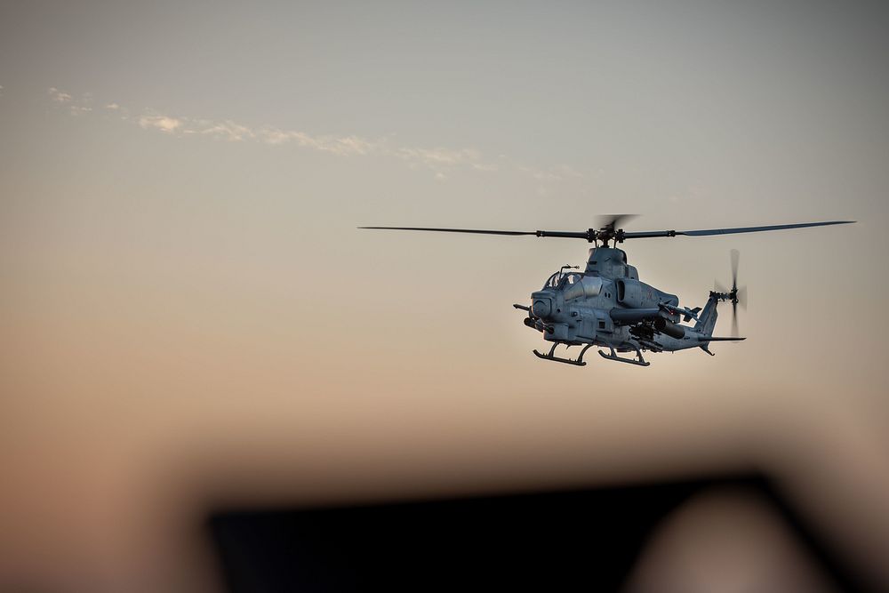 A U.S. Marine Corps AH-1Z Viper assigned to the Aviation Combat Element, 22nd Marine Expeditionary Unit (MEU), flies over…