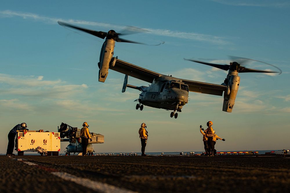 U.S. Marines assigned to the Aviation Combat Element, 22nd Marine Expeditionary Unit (MEU), and Sailors assigned to the Wasp…