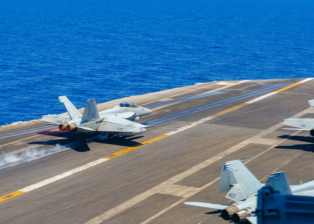 220713-N-FB730-1010 MEDITERRANEAN SEA (July 13, 2022) An F/A-18F Super Hornet, attached to the “Red Rippers” of Strike…