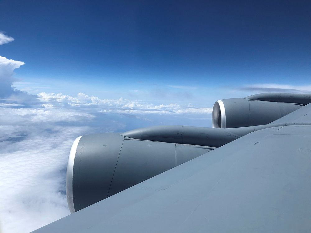 Airplane wing, blue sky view.