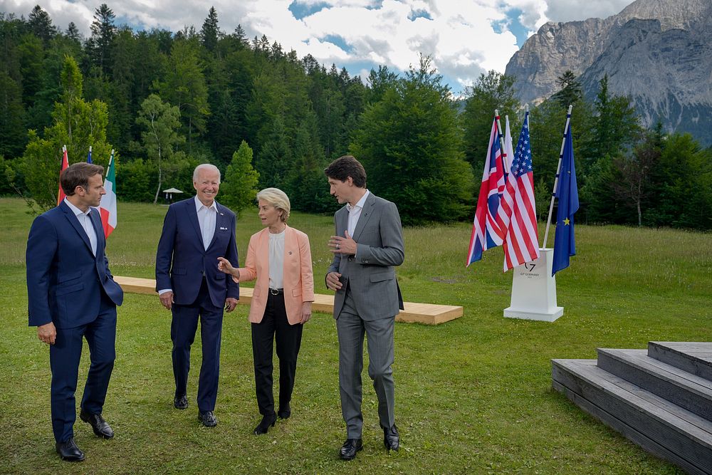President Joe Biden walks with French President Emmanuel Macron, European Commission President Ursula von der Leyen, and…