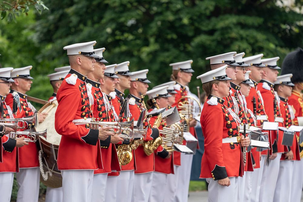 The President’s Own U.S. Marine Band stands at attention during President Joe Biden’s remarks at the Congressional Picnic…