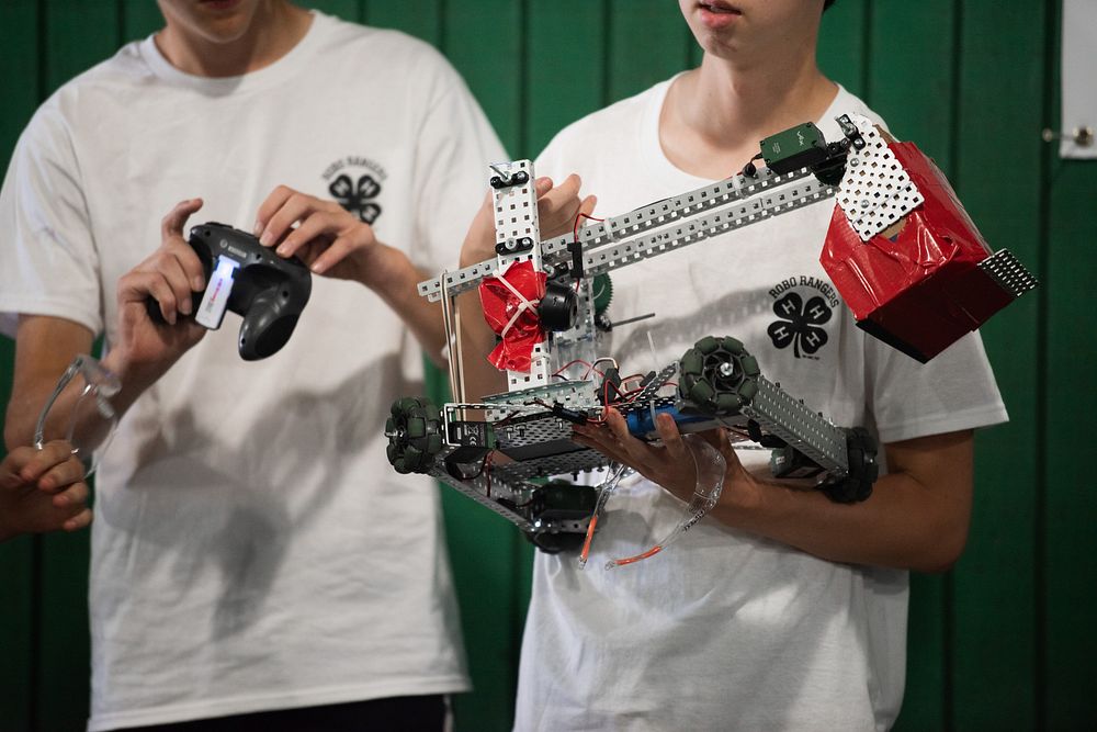 Young man and woman from Maryland, all under 18 years old, compete in a robotics challenge at the 2022 Maryland State Fair…