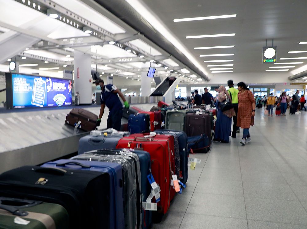 Airport luggage retrieval and passenger processing areas at John F. Kennedy (JFK) Airport.