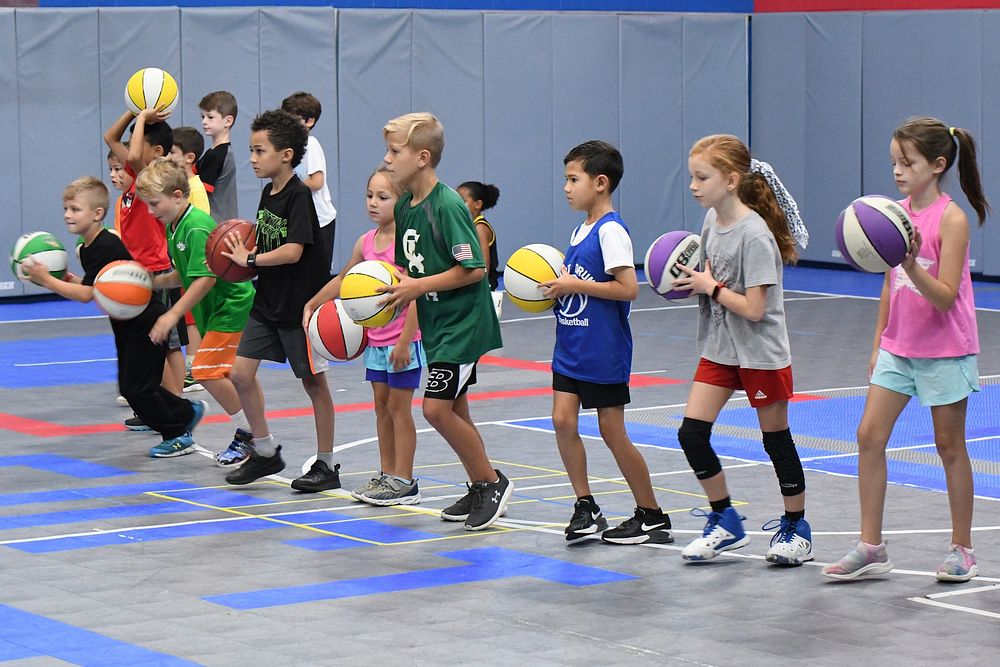 CYS Basketball Camp_11The Fort Drum Child and Youth Services’ Sports and Fitness Summer Camps program offered a variety of…